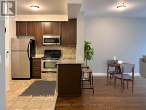 Oakville (Ro River Oaks) condo for rent - A kitchen with a refrigerator, oven, and microwave.