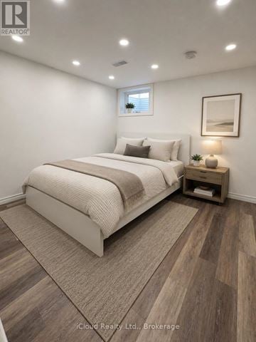 Hamilton (Centremount) apartment for rent - A bedroom with a large bed and a wooden floor.