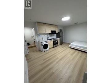 Burnaby townhouse for rent - A kitchen with a washing machine and a dishwasher.