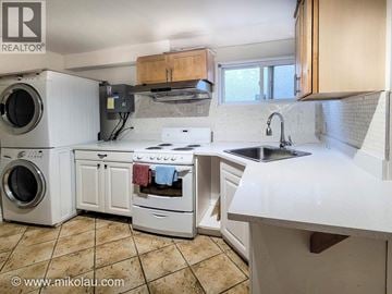 Vancouver apartment for rent - A white kitchen with tile flooring and a window.