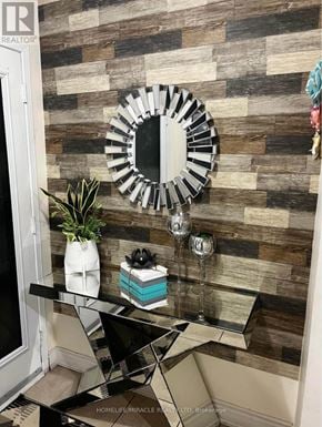 Brampton (Fletcher's Creek Village) apartment for rent - A mirror hangs on a wall above a glass table.