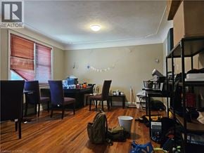Hamilton apartment for rent - A room with a table, chairs, and a backpack on the floor.
