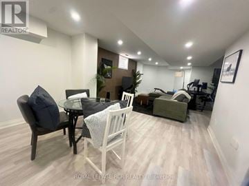 Shelburne apartment for rent - A living room with a black table and white chairs.