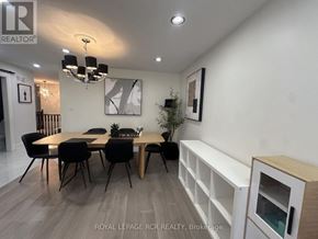 Shelburne apartment for rent - A dining room with a wooden table and chairs.