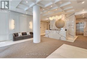 Toronto (Church-Yonge Corridor) condo for rent - A reception area with a white reception desk and a grey sofa.