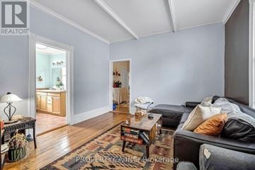 London North (North K) multi-family for rent - A living room with a black couch and a coffee table.