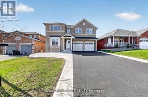 Innisfil (Alcona) apartment for rent - A house with a driveway in front of it.