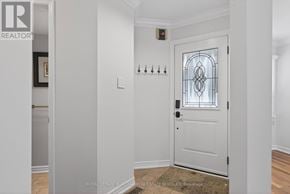 Oakville (Ro River Oaks) townhouse for rent - A white door with a glass window and a black handle.