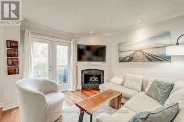 Oakville (Ro River Oaks) townhouse for rent - A living room with a fireplace and a painting on the wall.