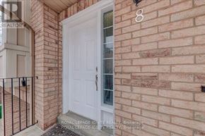 Mississauga (Hurontario) townhouse for rent - A white door is on the brick wall of a house.