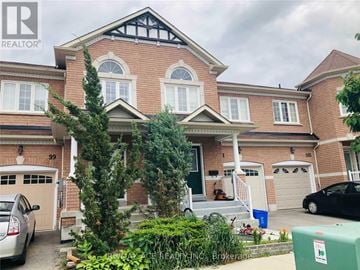 Ajax (Northwest Ajax) townhouse for rent - A house with a car parked in front of it.