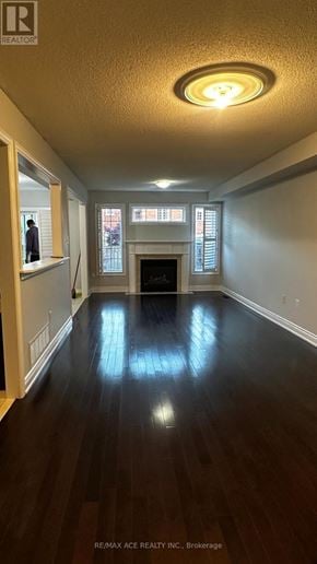 Ajax (Northwest Ajax) townhouse for rent - A long hallway with wood floors and a light on the ceiling.