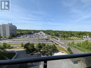 Toronto (Agincourt South-Malvern West) condo for rent - A view from a balcony looking out over a parking lot and highway.