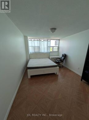Toronto (Agincourt South-Malvern West) condo for rent - A bedroom with a bed, a chair, and a window.