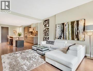 Vancouver townhouse for rent - A living room with a white couch and a grey rug.