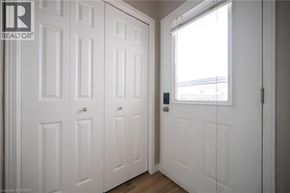 Brantford apartment for rent - A white door with a window on the right side.