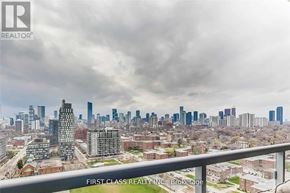 Toronto (Regent Park) condo for rent - A cityscape with a cloudy sky and a building in the foreground.