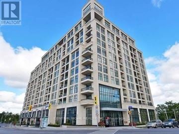 Toronto (High Park-Swansea) condo for rent - A tall building with the sign "Central Home Realty" on the front.