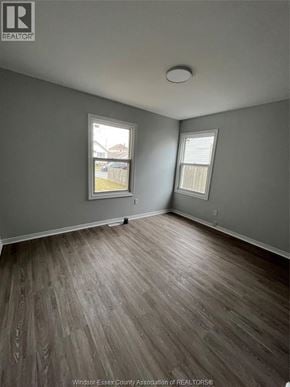 Windsor apartment for rent - A room with grey walls and wooden flooring.