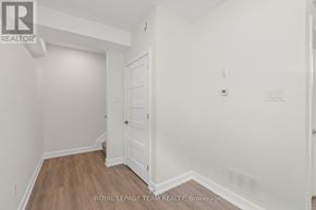 Ottawa multi-family for rent - A white door is in a white room.