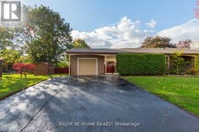 Oshawa (Donevan) apartment for rent - A house with a driveway and a garage door is for sale.