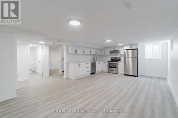 Oshawa (Donevan) apartment for rent - A spacious kitchen with white cabinets and stainless steel appliances.