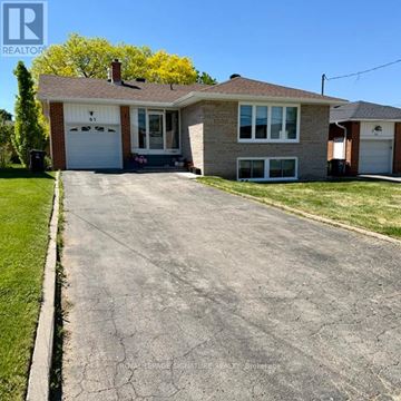 Toronto (Victoria Village) apartment for rent - A house with a driveway in front of it.