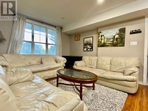 Toronto (Centennial Scarborough) townhouse for rent - A living room with a white couch and a coffee table.