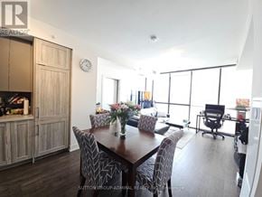 Vaughan (Concord) condo for rent - A dining room with a wooden table and chairs.