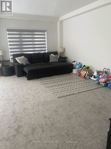 Brant (Paris) apartment for rent - A living room with a black couch and a rug.