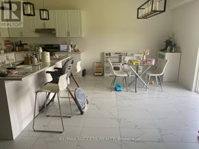 Brant (Paris) apartment for rent - A kitchen with a dining table and chairs.