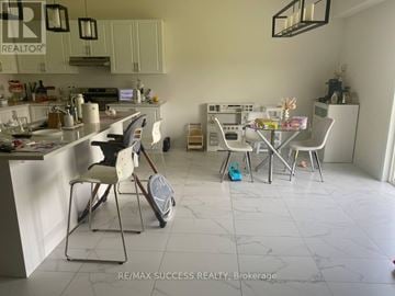 Brant (Paris) apartment for rent - A kitchen with a dining table and chairs.