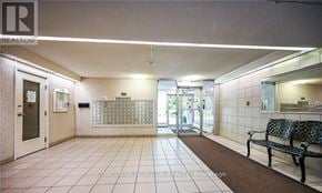 Hamilton (Ainslie Wood) condo for rent - A hallway with a bench and a sign that says "REALTOR".