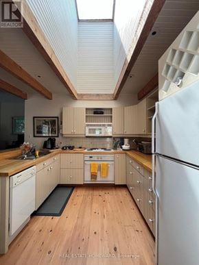 Rideau Lakes apartment for rent - A kitchen with wooden floors and a skylight.