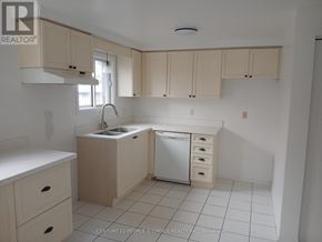 Guelph (Kortright West) apartment for rent - A kitchen with white cabinets and a white dishwasher.