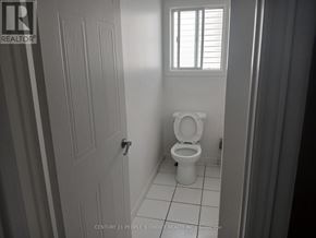 Guelph (Kortright West) apartment for rent - A bathroom with a toilet and a door.