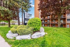 London North (North C) condo for rent - A sign for 1560-1580 Adelaide Street N is in front of a building.