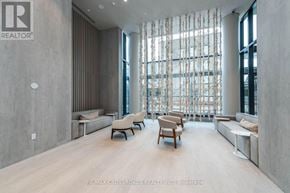 Toronto (Waterfront Communities) condo for rent - A spacious living room with wooden floors and furniture.