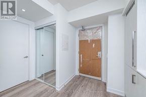 Toronto (Waterfront Communities) condo for rent - A room with a glass door and a wooden door is shown.