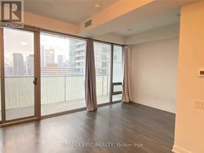 Toronto (Church-Yonge Corridor) condo for rent - A room with a sliding glass door leading to a balcony.