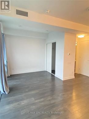 Toronto (Church-Yonge Corridor) condo for rent - A spacious room with a grey floor and white walls.