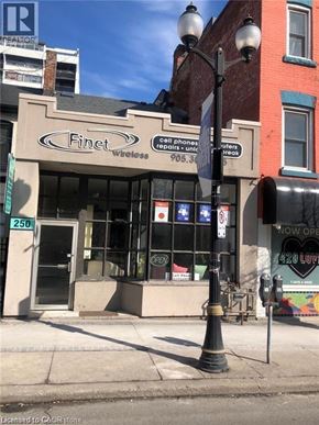 Hamilton apartment for rent - A street view of a building with a sign that says "Finet Cell Phone Repair".