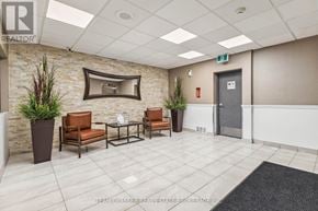 London East (East K) condo for rent - A waiting area with chairs and a flat screen TV.