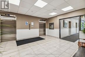 London East (East K) condo for rent - A reception area with a white tile floor and a black mat.