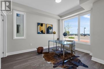 Orillia townhouse for rent - A modern living room with a glass coffee table and a cowhide rug.