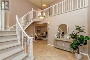 Ottawa apartment for rent - A staircase with a white railing leads to a living room.