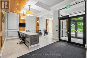Ottawa condo for rent - A brokerage office with a desk and chairs.
