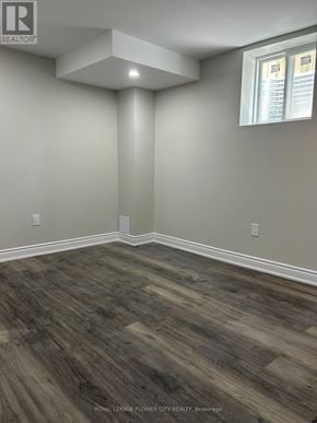 Brantford apartment for rent - A room with wooden flooring and a window.