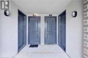 Cambridge townhouse for rent - Three doors are closed and have a mat in front of them.