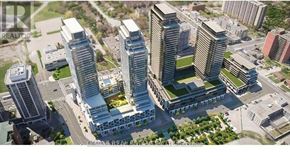 Toronto (Newtonbrook East) condo for rent - A real estate company logo is displayed on a building in a cityscape.